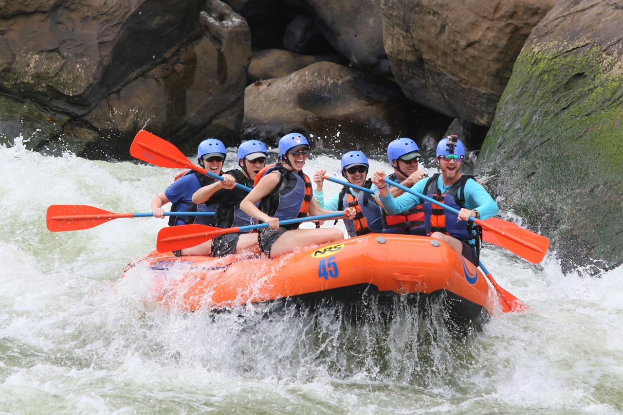 A raft dropping into a rapid on the Beas